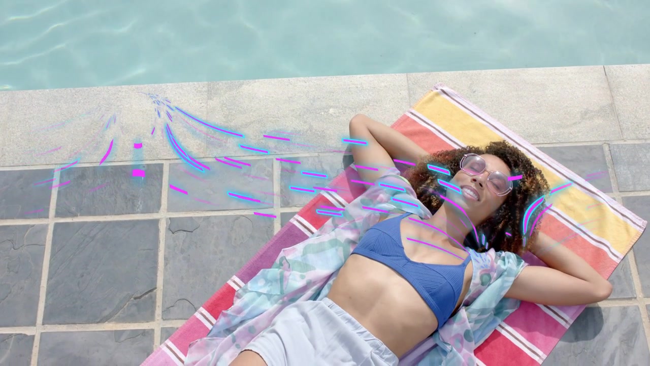 Woman lying on towel at pool, purple-blue streaks sweeping over head opening eyes smiling for brand