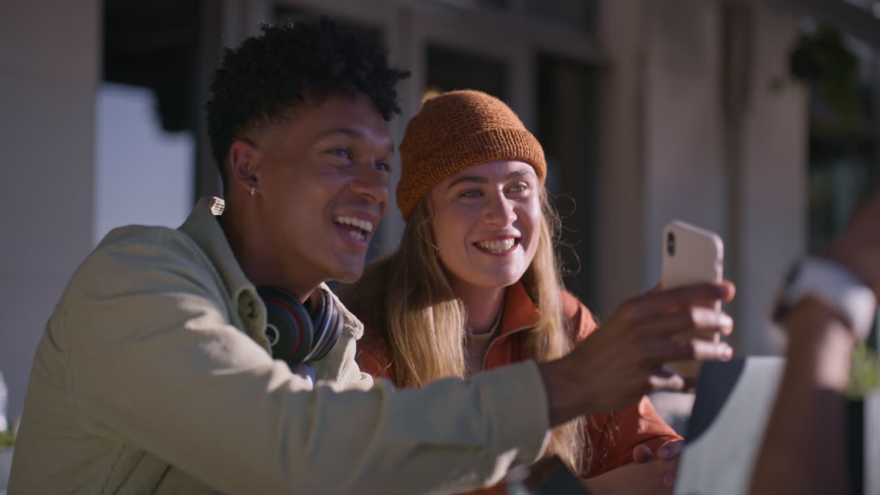 Two people taking a selfie outdoors