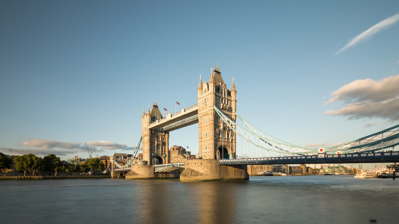 Time lapse of Tower Bridge in London, UK on a sunny day with blue sky and a few clouds