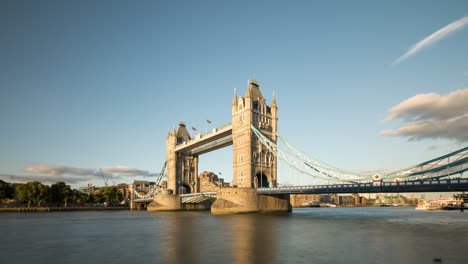 time lapse of tower bridge in london, uk on a sunny day with blue sky and a few clouds