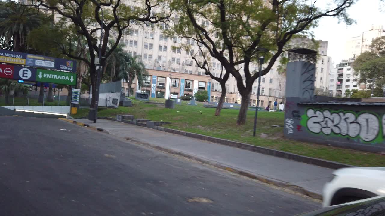 POV Car drive through clinic hospitals and recoleta neighborhood urban green park, housay plaza