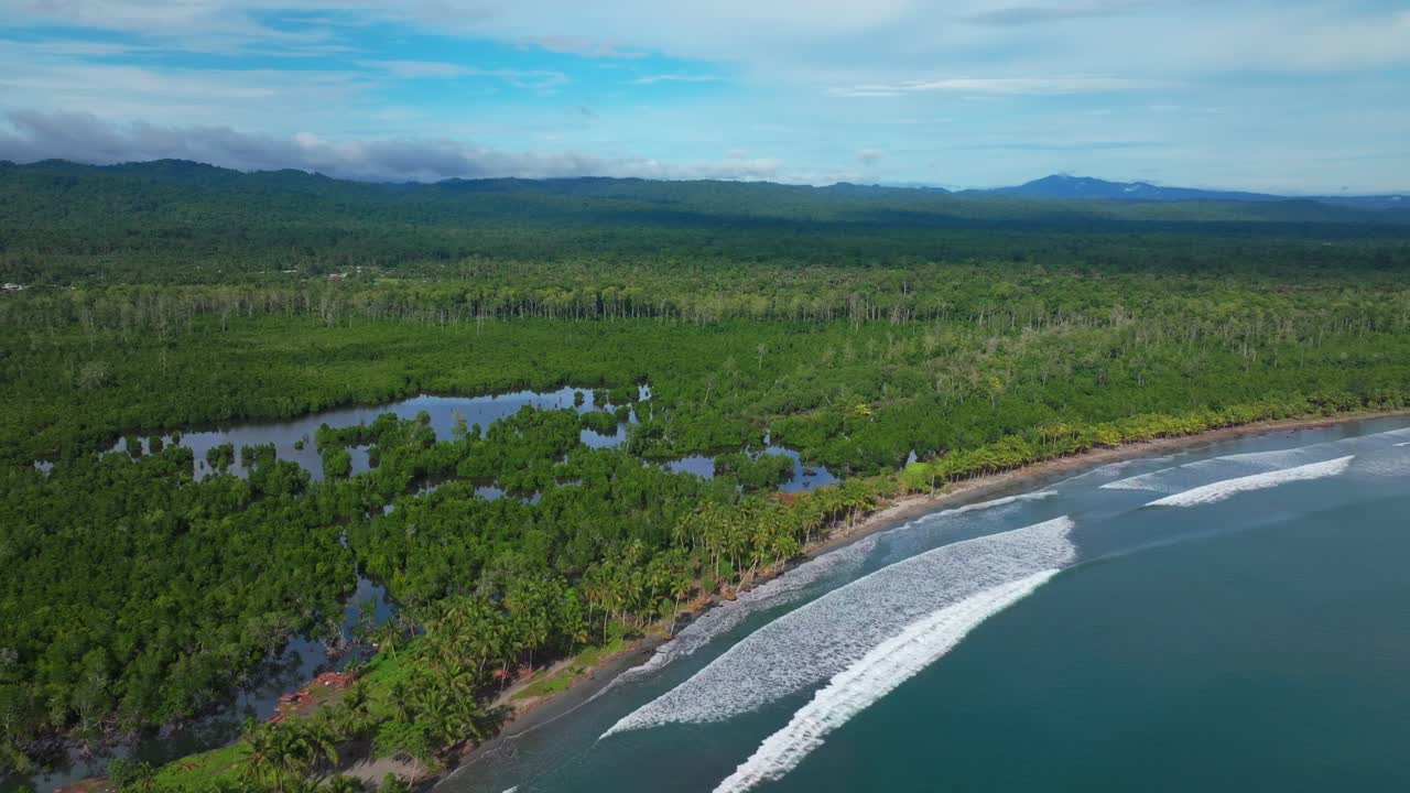 Wewak waves sea harbour view Wewak Hill Cape Wom Dogreto aerial drone Papua New Guinea Pacific Ocean pristine remote tropical beach coastline sunny dry season blue sky morning mountains backwards
