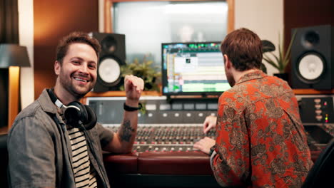 people working in a music recording studio