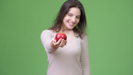 young happy beautiful woman holding apple