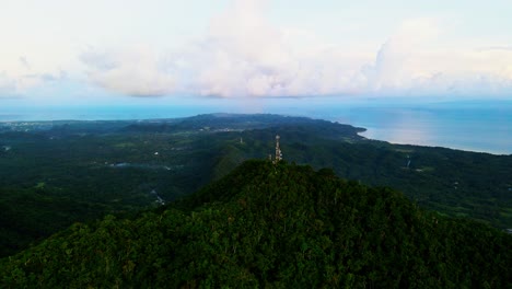 mount cagmasuso with phone telecommunications tower in san andres,catanduanes, philippines - drone shot