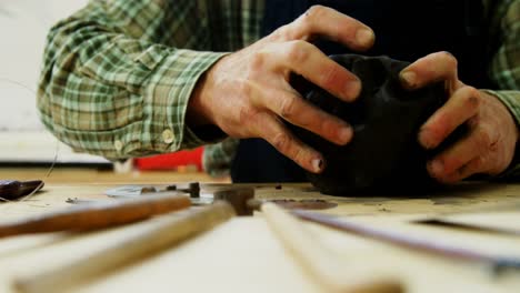 craftsman working on clay sculpture 4k