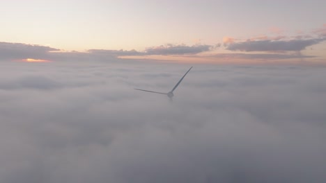 drone shot of a windturbine in cloudy conditions