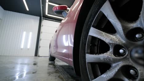 washing the car. cleaning aluminum wheels. car wash.