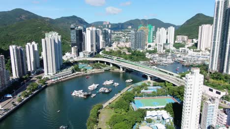 Aberdeen-harbour-and-skyline-in-southwest-Hong-Kong-island-on-a-beautiful-day,-Aerial-view