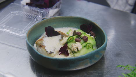 exquisite fish dish with zucchini and beet garnish