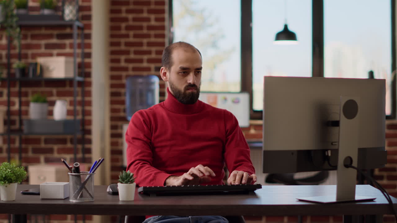 Project manager using computer to analyze business charts