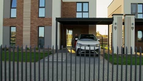 modern house with electric car in driveway