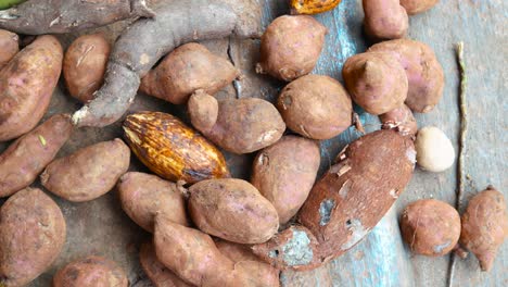 Red-potatoes-stack-on-wooden-plates-outdoors,Dominican-republic