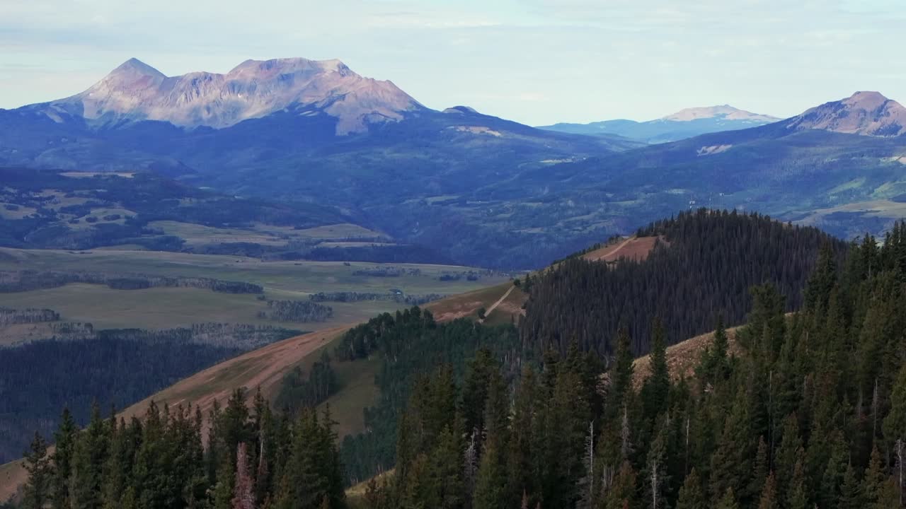 Summer Last Dollar Road aerial drone Mount Sneffels Wilderness San Juan Rocky Mountains Telluride airport four wheel drive Colorado Uncompahgre Forest blue sky landscape parallax upward motion