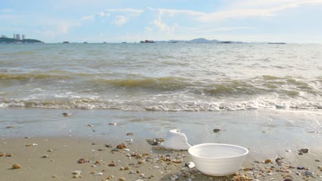 garbage plastic cup on the beach