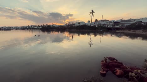 sunset over a calm river in a spanish village