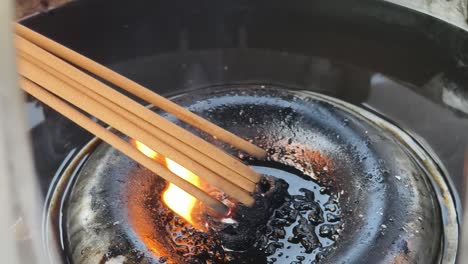 burning incense in a temple