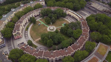 Spectacular-aerial-top-view-flight-Ghetto-Building-Mehringplatz-place-city-Berlin-steglitz,-Germany-Summer-day-2023