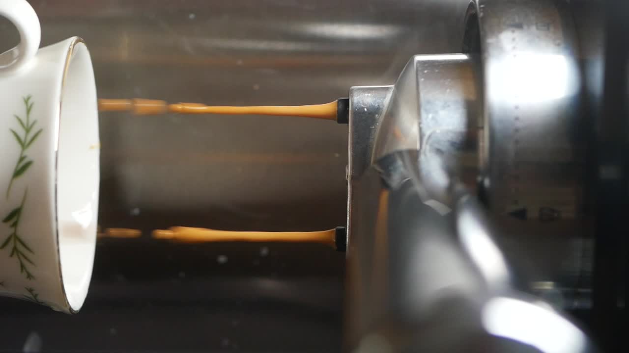 Espresso being poured into a cup