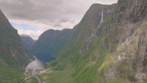 Gudvangen-valley-with-Kjelfossen-waterfall-on-high-mountain,-Norway,-aerial