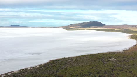 Excellent-Aerial-Shot-Of-The-Greenery-And-Slopes-Surrounding-The-Frozen-Over-Lake-Greenly-In-Eyre-Peninsula,-South-Australia