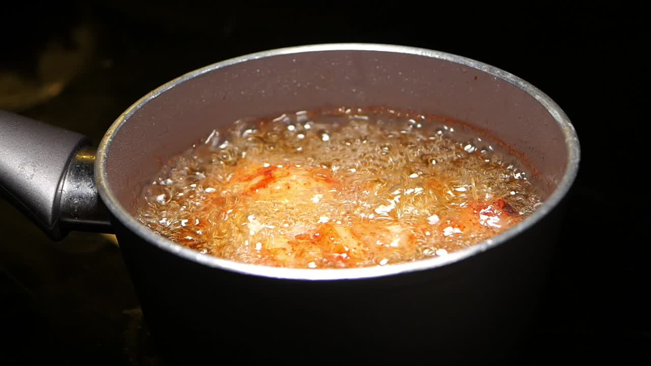 Food being deep fried in a pot