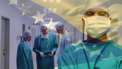 animación de la bandera de bosnia y herzegovina sobre un cirujano biracial de pie en el pasillo del hospital