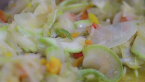 cooking a vegan saute of vegetables. closeup