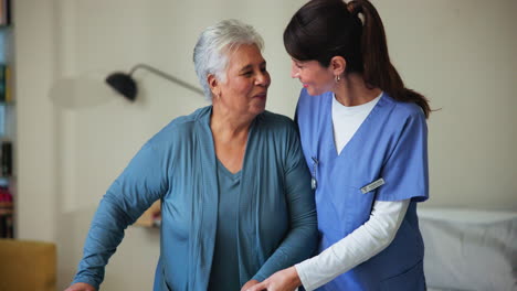 nurse helping an elderly woman in her home