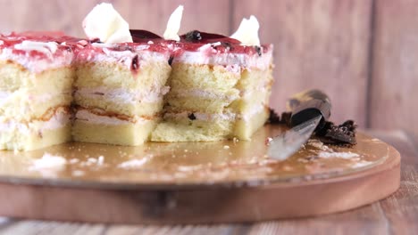 sliced berry cream cake