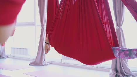 red aerial fly yoga hammocks support relaxed women bodies