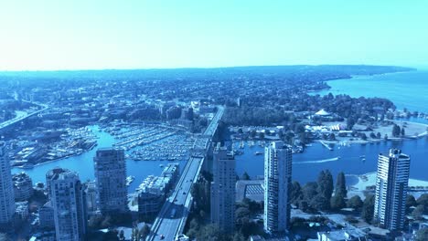 aerial-flyover-downtown-Vancouver-Burrard-Street-vintage-bridge-overlooking-Yaletown-condo-luxury-waterfront-modern-architecture-high-rise-buildings-towards-Kitsilano-Vanier-beach-vanstock2-2