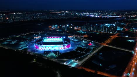 night aerial view of a freeway intersection and football stadium spartak moscow otkritie arena