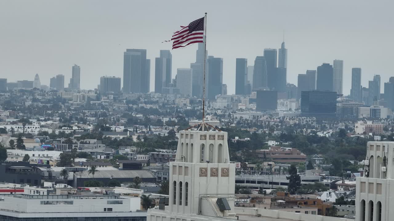 American Flag Aerial with Downtown Los Angeles Skyline in Background