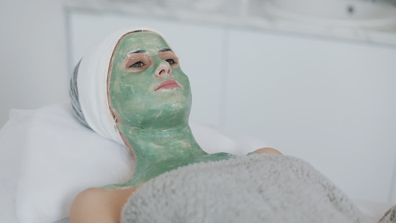 Woman receiving a facial treatment at a spa