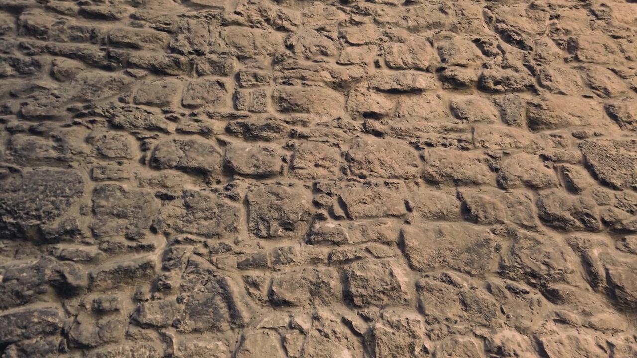 Antico muro medievale in pietra. Un elemento di architettura antica.