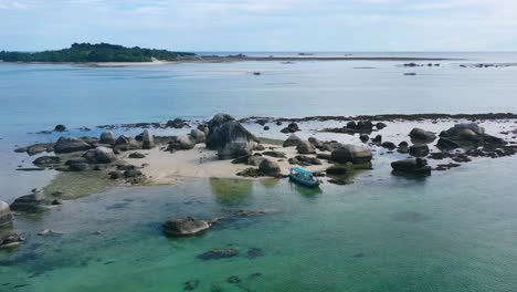 aerial of remote rocky island in tropical waters of belitung indonesia