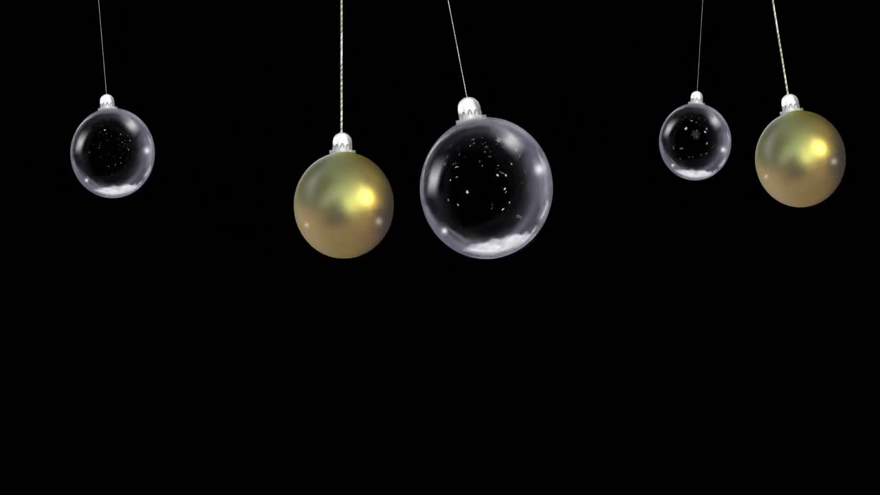 Animation af dinglende julekugler over faldende sne på sort baggrund