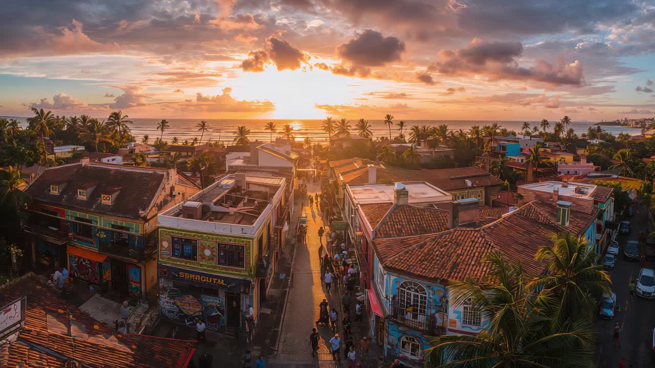 Gliding drone camera revealing main street sunset, people walking in casual wear toward sea, palms