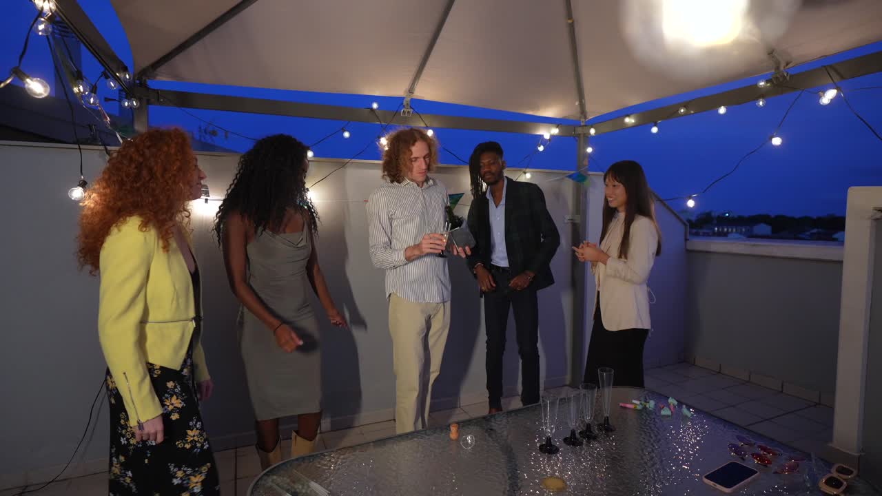 Friends celebrating a special occasion with champagne on a rooftop party