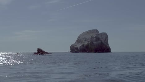 A-slow-motion-gimbaled-shot-of-a-tiny-volcanic-island-in-the-Sea-of-Cortez