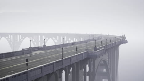 fog envelops long bridge creating an atmospheric view in a quiet setting