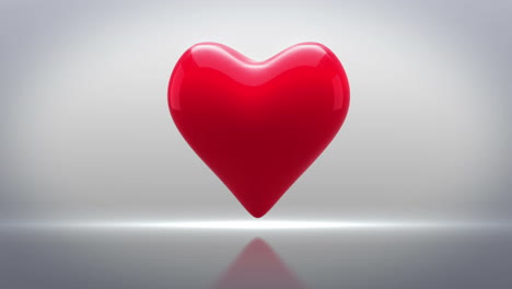 Red-heart-thumping-on-grey-background