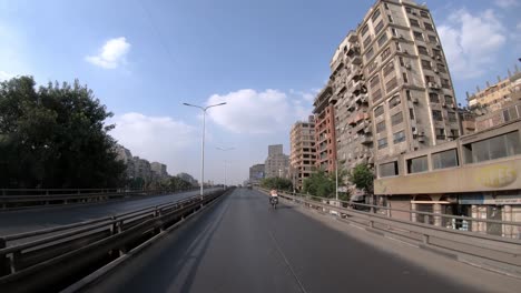 a view through the window of a taxi traveling on the highway in cairo