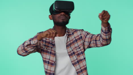 Man-using-virtual-reality-futuristic-technology-VR-headset-helmet-to-play-simulation-3D-video-game