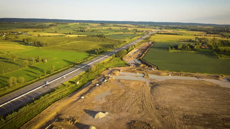 drone panning across a busy highway in the rural countryside