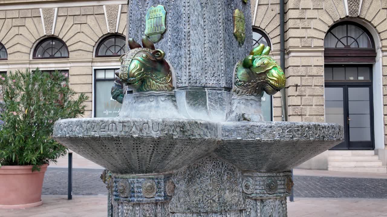 Pécs’ iconic Zsolnay Fountain, showcasing its ornate decorative elements and historic charm