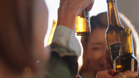 happy group of friends making toast having fun drinking socializing hanging out chatting sharing conversation enjoying reunion gathering at sunset