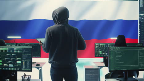 Shady-person-working-in-a-Russian-governmental-cyber-defense-room