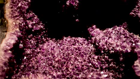 close-up of a large amethyst geode display